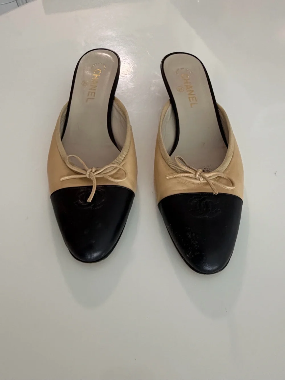 CHANEL Beige and Black Leather Bow-Trim Slip-On Mules